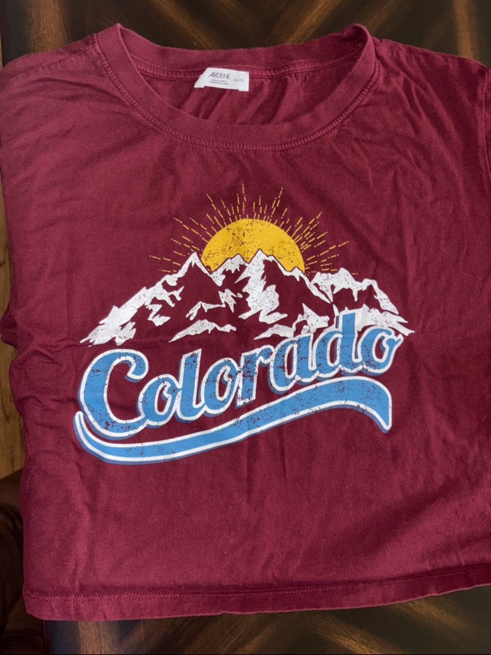 Ardene Burgundy Colorado Graphic Tee with Yellow Sun and Blue Script